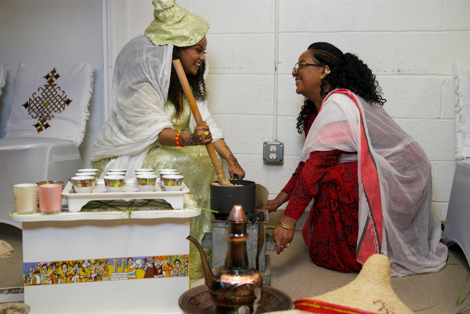 Women in traditional Tigrayan dress preparing a coffee ceremony