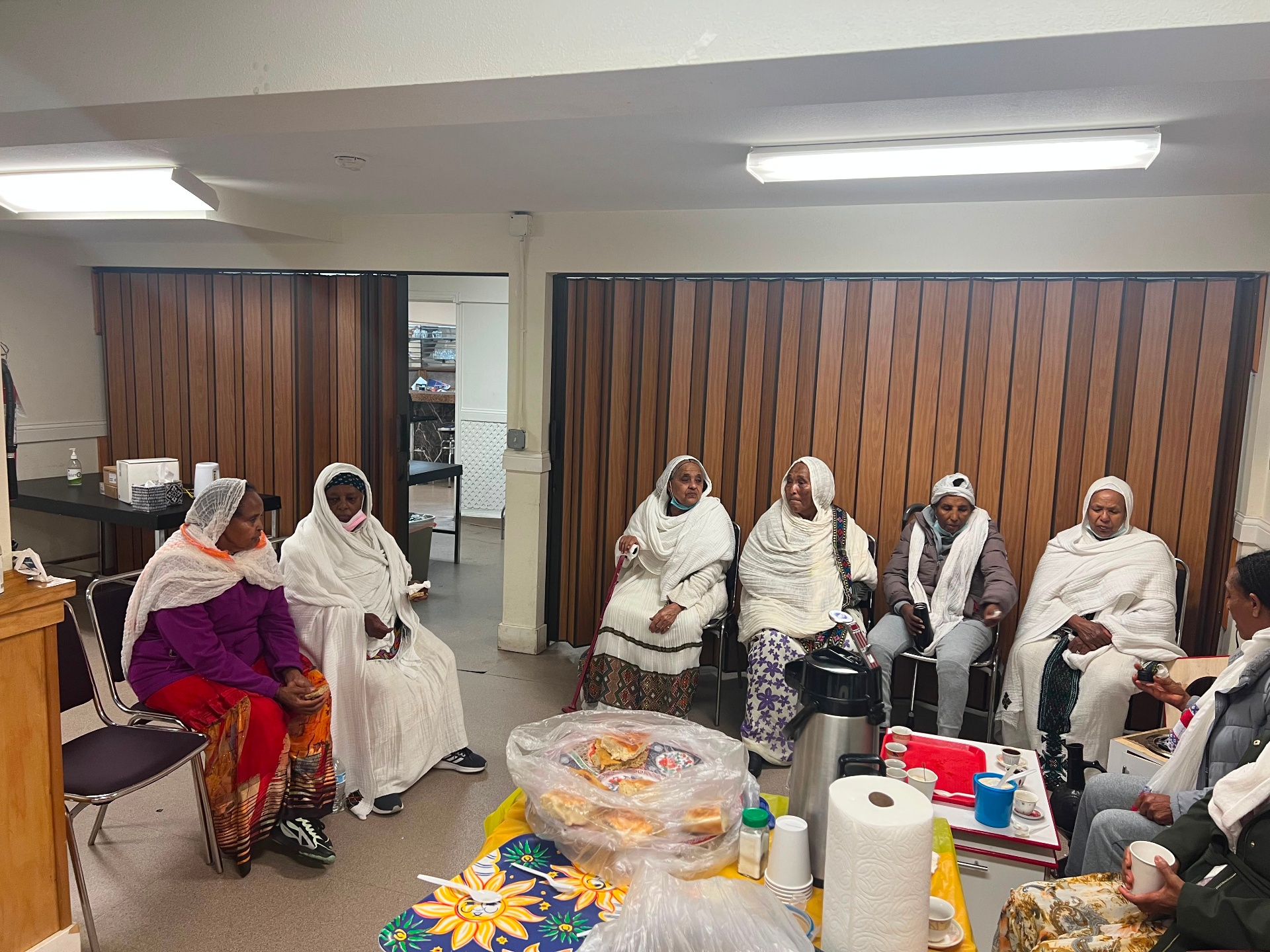 Tigrayan elder women in traditional white netela gathered for fellowship